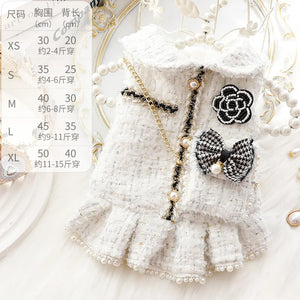 Coco step aside! Paris couture for your baby bling! So chic. All of the embellishments your little boo bug could wish for! Pearls and gold trim accentuate this little tweed charmer. Channel your Chanel and step out in style!